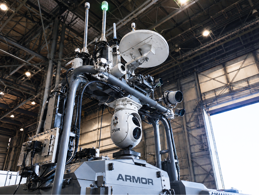 ARMOR platform sensor mast — gimballed EO/IR camera, satcom dome, and sensor stack visible in hangar reference build